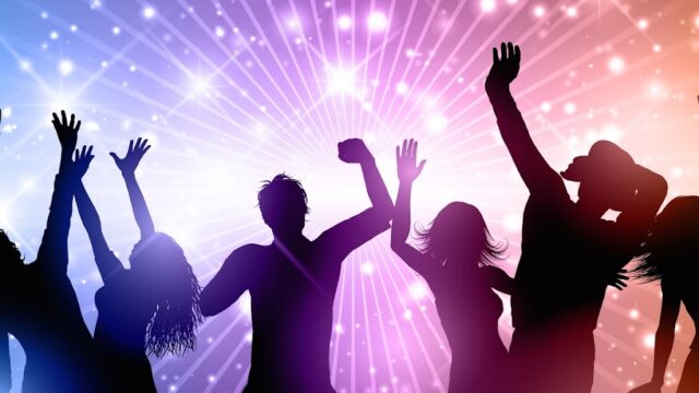Silhouettes of people dancing on an abstract background