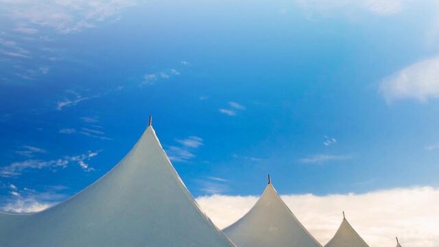 Top of a large event tent against a blue sky in Stowe, Vermont, USA