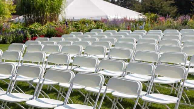 Single Location 4 White chairs set up for an outdoor wedding