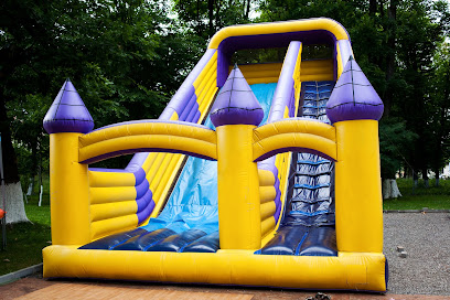 Inflatable big bouncy castle slide in a park